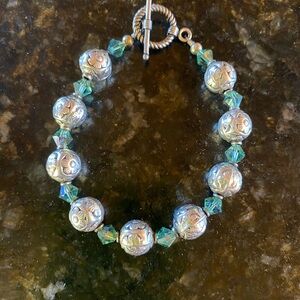 Silver flower and teal beaded bracelet